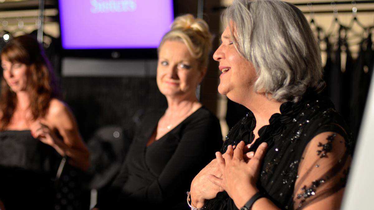 Erica House, left, and Janet Scott watched Georgeanne Edwards, right, perform a scene in Love, Loss and What I Wore. The cast includes Susan ­Wigglesworth, Samantha Doane-Bates and Stephanie Peniston. The show runs through June 2.