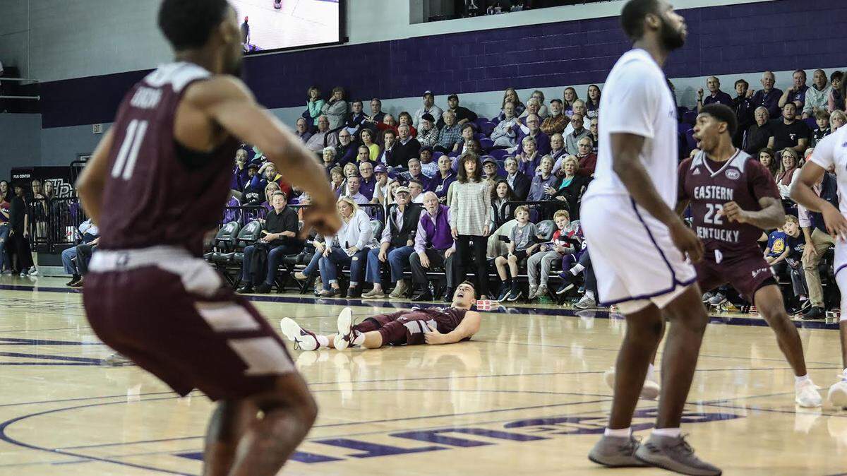 Nick Mayo, on his back on the court, after his three-point shot just before the final buzzer gave visiting Eastern Kentucky a 70-69 victory over High Point on Dec. 1st, 2018.