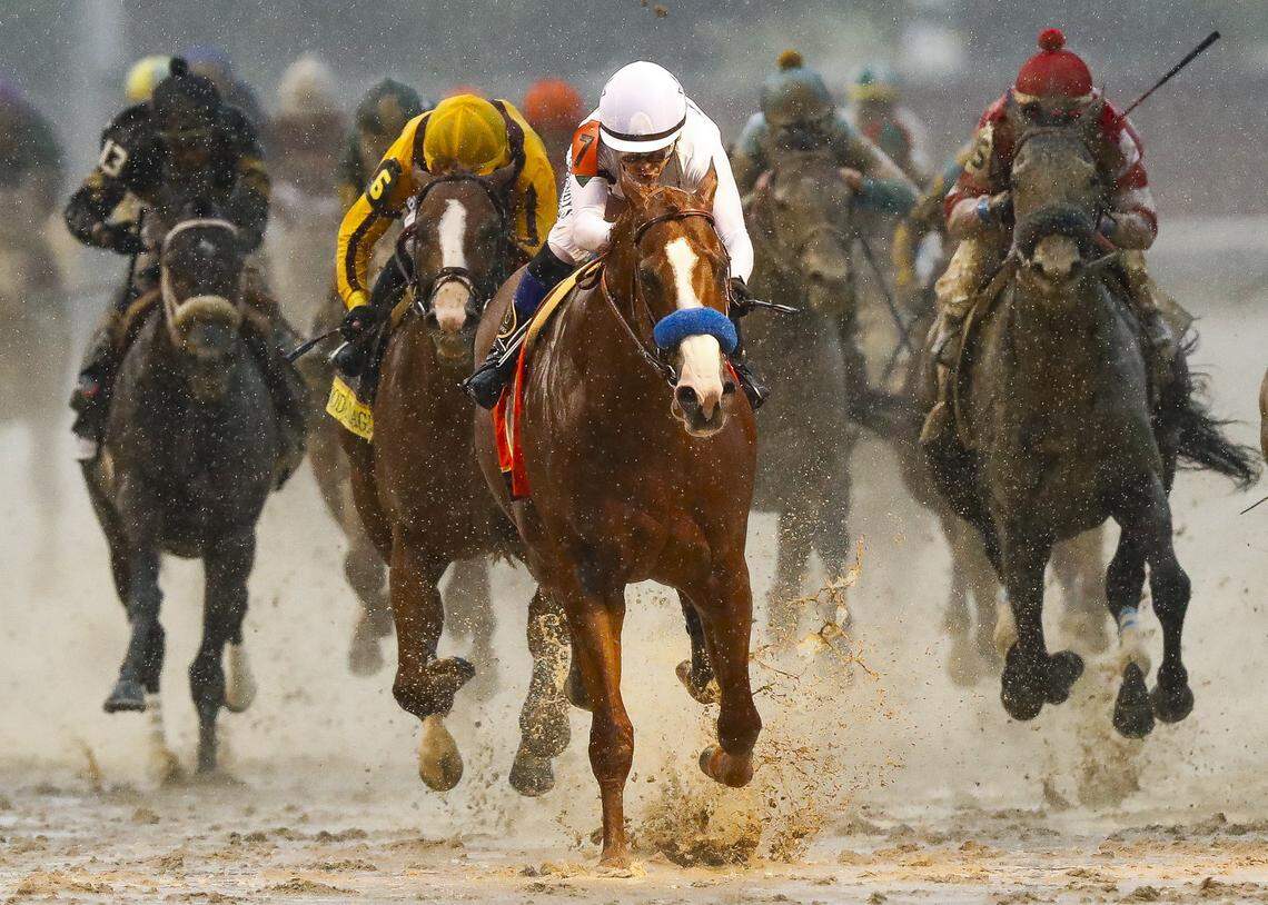 Justify, with Mike Smith up, center, outran Good Magic (6) and Audible (5) to win the Kentucky Derby in 2018.