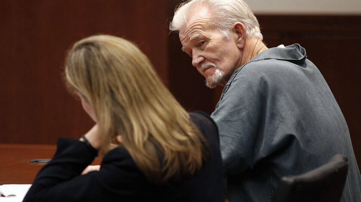 Marty Roe, right, sat with public defender Shannon Brooks-English in court in 2011, shortly after the death of the Lexington doctor he was accused of killing. Photo by Charles Bertram | Staff
