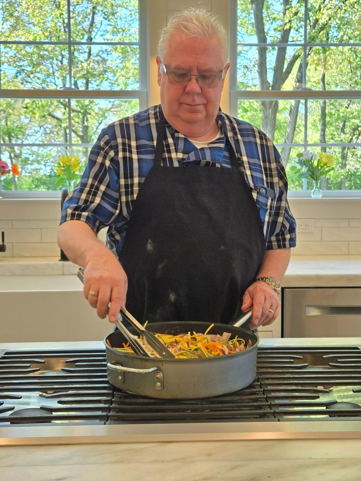 Chef Rodney Jones of Rodney’s on Broadway prepares the entree.