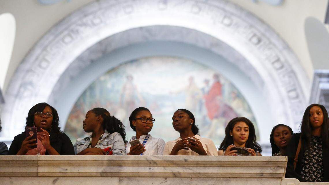 Students from Central High School in Louisville watched a demonstration on Aug. 30, 2017, calling for the removal of the Jefferson Davis statue from the Capitol Rotunda in Frankfort.