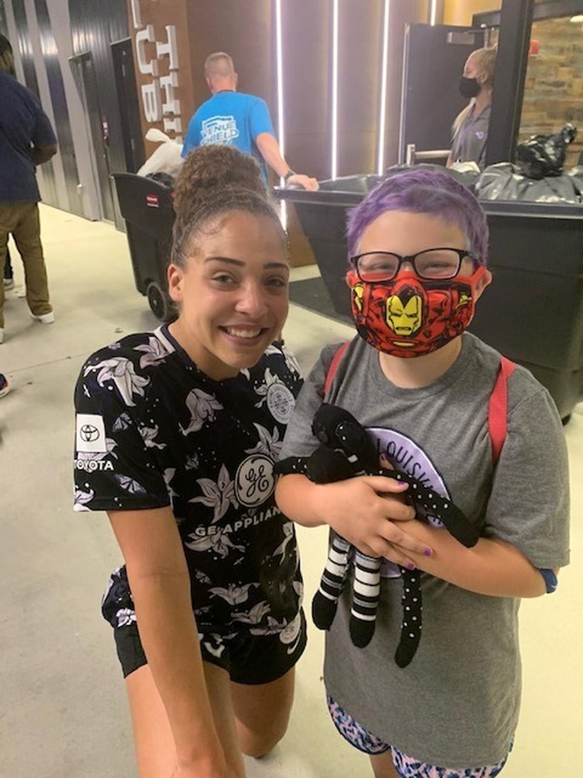 Ellie Hurley, right, stands with Louisville Racing Football Club forward Jorian Baucom. Photo courtesy of Morgan Hurley.