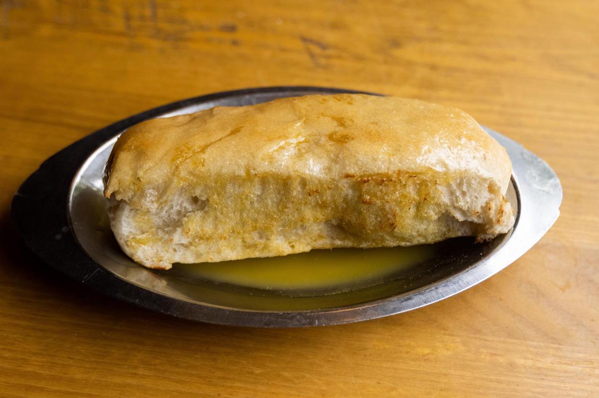 Pasta dishes from PapaLeno’s come with the large bread stick and plenty of garlic butter.