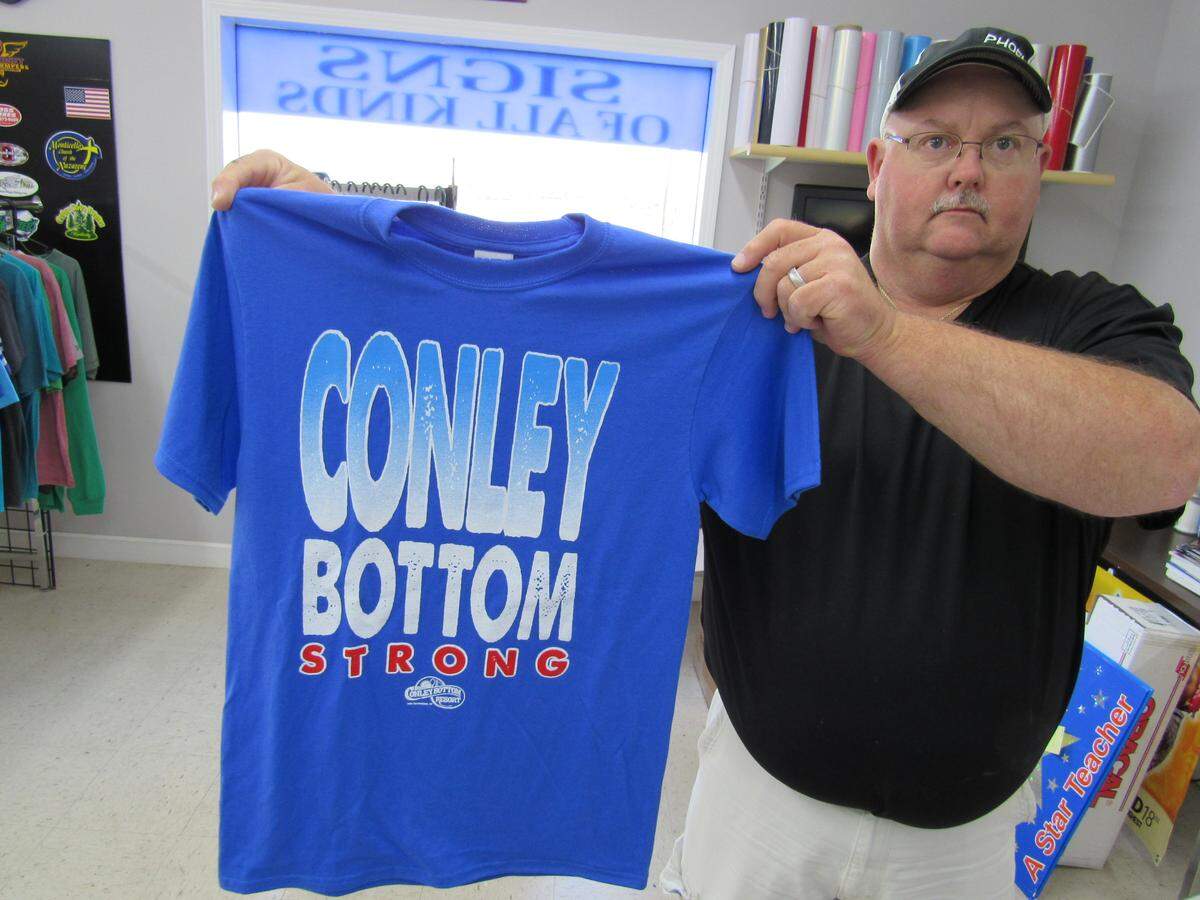 Leroy Gosser, owner of a screenprinting business, had T-shirts created that will help raise some money for repairs at Conley Bottom Resort on Lake Cumberland, which was damaged by a fire on May 20, 2019.