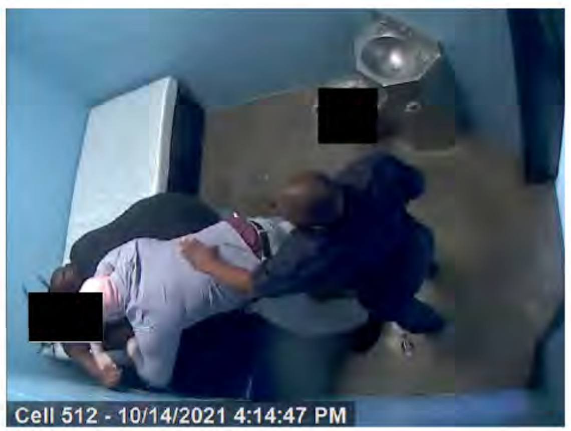 Staff struggle to restrain a youth on Oct. 14, 2021, inside the Jefferson Regional Juvenile Detention Center.