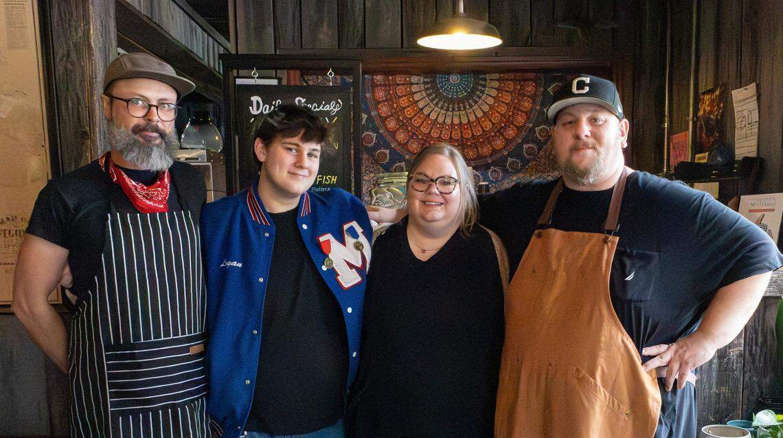 From left to right: Ryan Elliott, son of Nolan and Cassie; Logan Colliver, Cassie Jones, and restaurant owner Nolan Colliver pose for a picture at their new barbecue restaurant, Nolo's On The Levee, on Jan. 23, 2026, in Mt. Sterling, Ky.