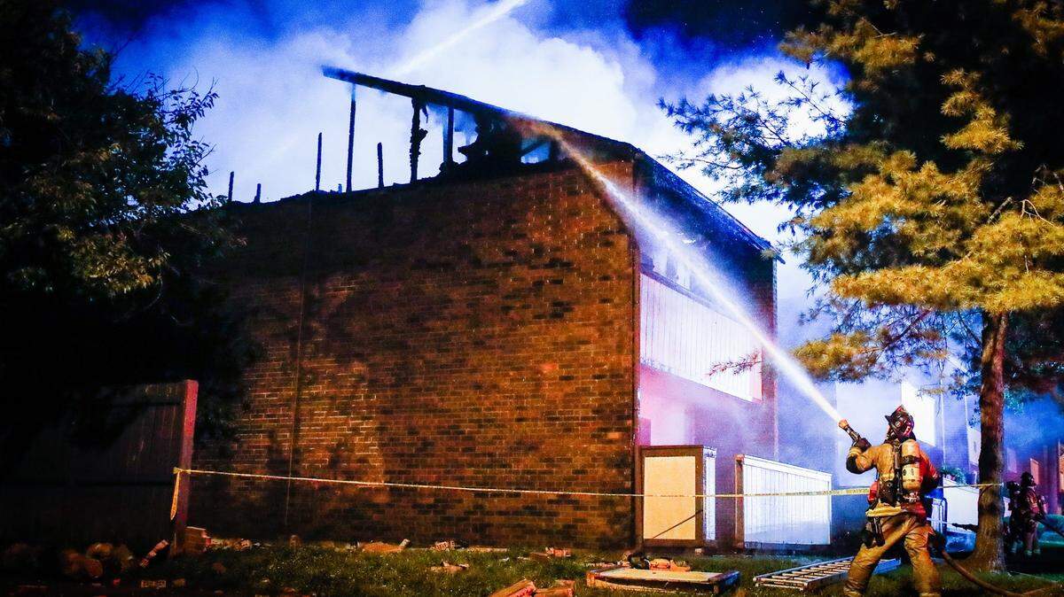 Lexington firefighters battle a fire at Pinebrook Apartments off of Tates Creek Road on Friday, Sept. 3, 2021, in Lexington, Ky. Residents in four apartments were displaced, according to a fire department spokesman.