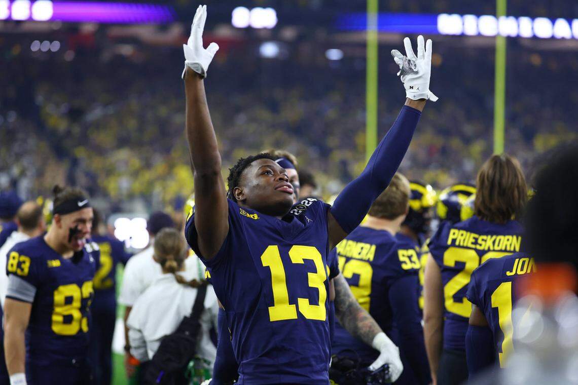Jan 8, 2024; Houston, TX, USA; Michigan Wolverines defensive back DJ Waller Jr. (13) celebrates after a touchdown against the Washington Huskies during the first quarter in the 2024 College Football Playoff national championship game at NRG Stadium. Mandatory Credit: Mark J. Rebilas-USA TODAY Sports
