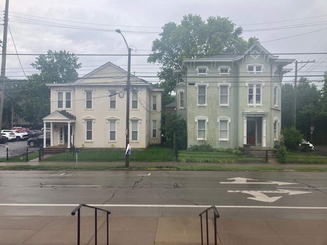 Two of the buildings that will be torn down on East Maxwell Street to make room for a new 8-story apartment building near the University of Kentucky’s campus.