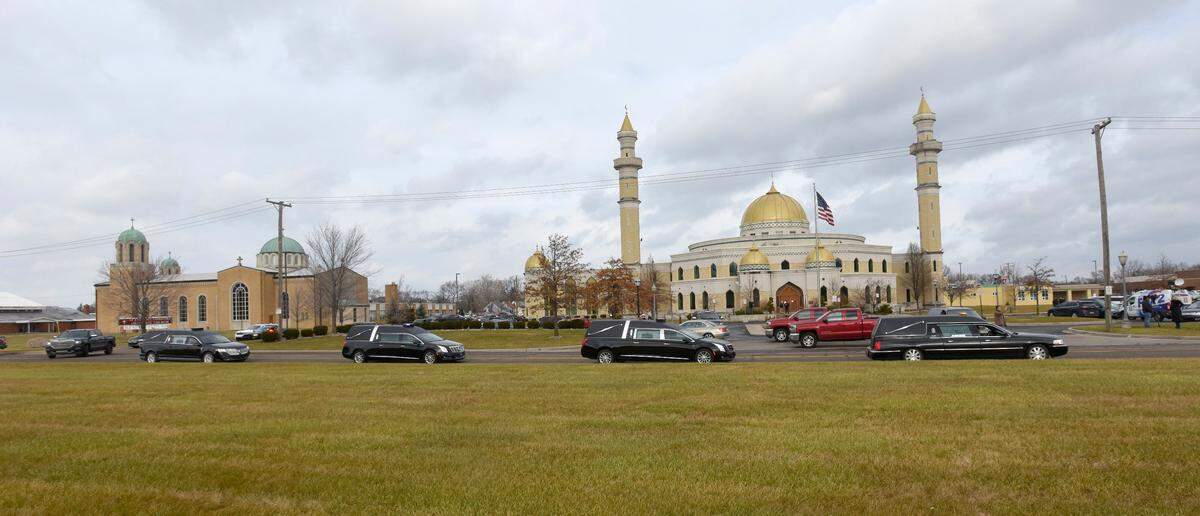 Hearses passed in front of the Islamic Center of America Jan. 8, 2019, in Dearborn, Mich., after funeral services for five members of the Abbas family, who were killed in a head-on collision in Kentucky while returning from a family vacation.