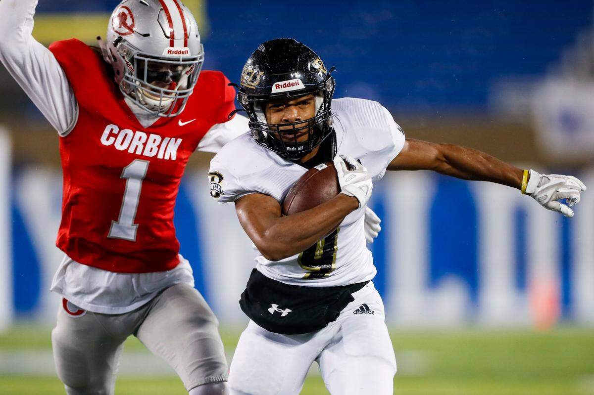 Montavin Quisenberry (9) tried to outrun Corbin’s Joe Lester (1) during Friday night’s Class 4A state finals. Quisenberry scored a touchdown on a 21-yard run for Boyle County.