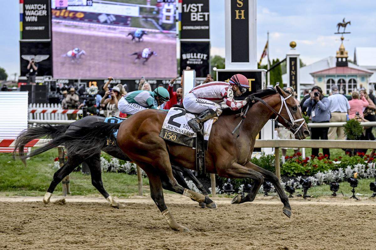 May 17, 2025; Baltimore, Maryland, USA;  Journalism (2) with Umberto Rispoli up defeats Gosger (9) with Irad Ortiz Jr. up to win the running of the 150th Preakness stakes. Mandatory Credit: Tommy Gilligan-Imagn Images