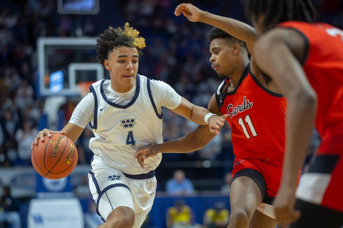 Warren Central’s Kade Unseld (4) drives against Jerone Morton of George Rogers Clark (11). Unseld scored 17 points in the state finals win.