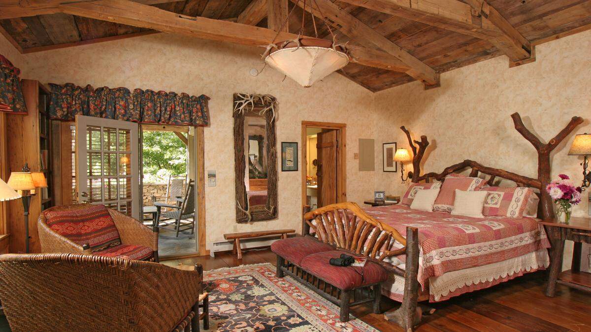 The Terrace Room is actually two room with two baths, a beamed ceiling and a towering fireplace.
