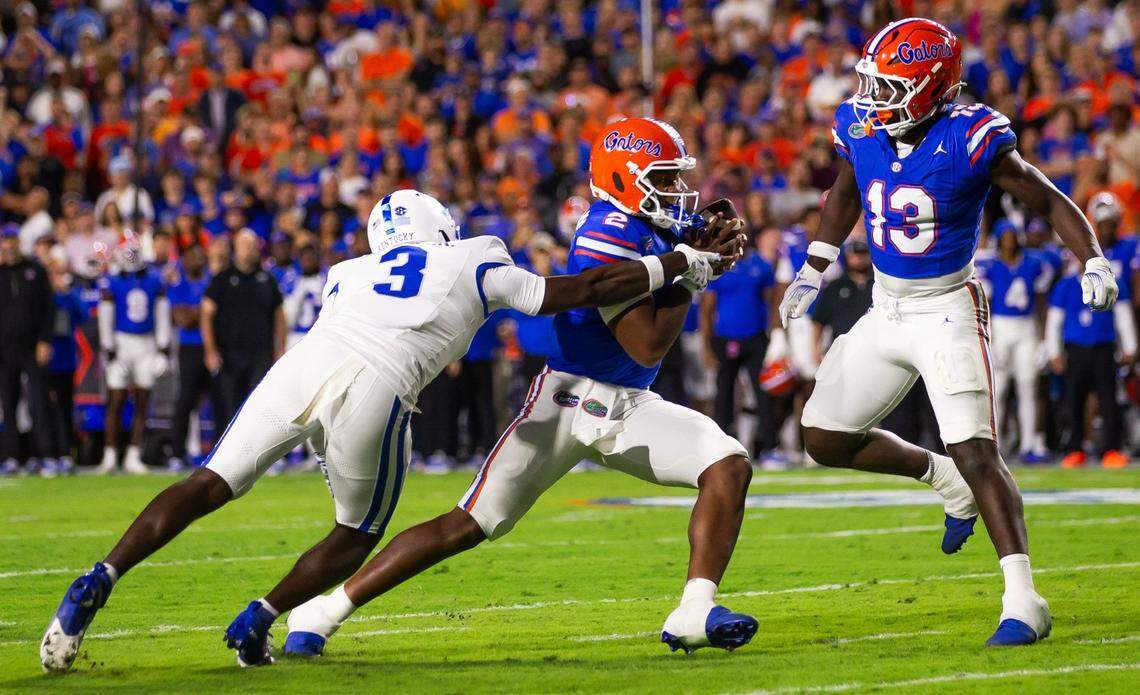Kentucky Wildcats defensive back Alex Afari Jr. (3) pursues Florida Gators quarterback DJ Lagway (2) during the first half at Ben Hill Griffin Stadium in Gainesville, FL on Saturday, October 19, 2024 against the Kentucky Wildcats. [Doug Engle/Gainesville Sun]