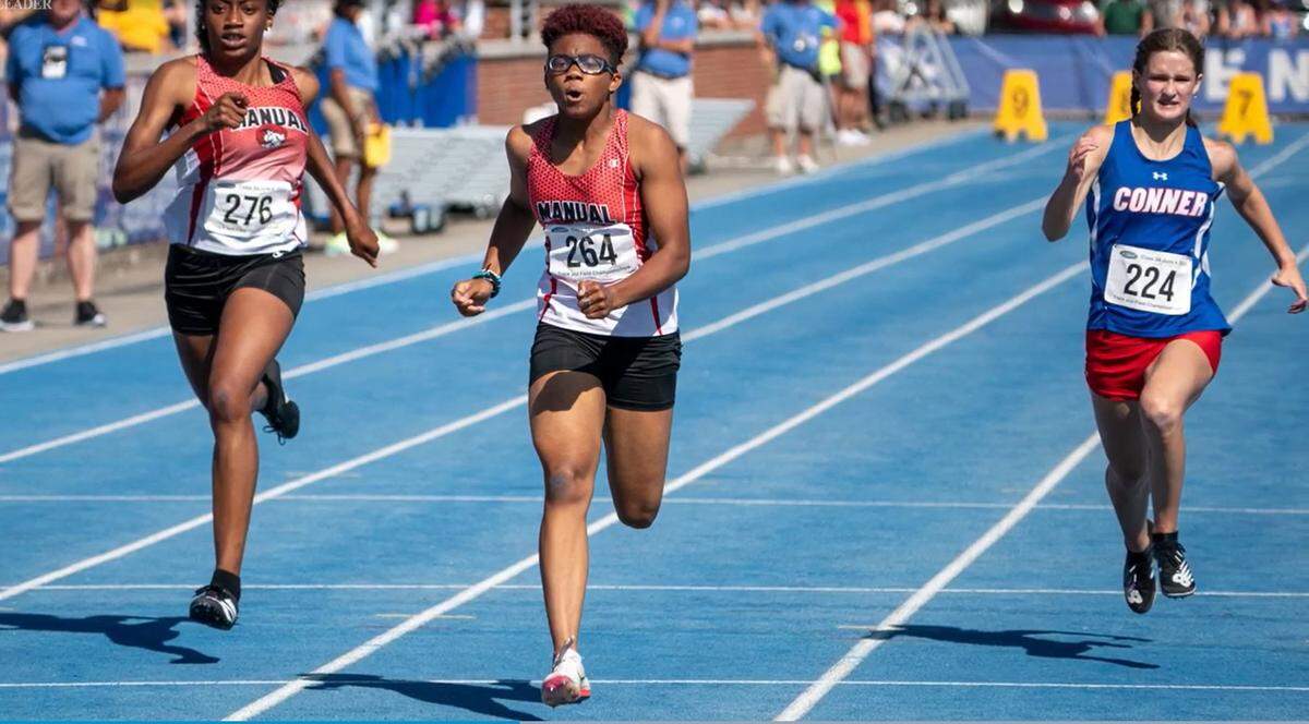 Manual’s Alexandra Allen (264) held off teammate Ruby Nuwso, left, and Conner’s Isabella Vonlehma, right, to win the 100-meter dash on Saturday and help lead her team to the Class 3A championship. Allen and Nuwso also finished first and second in the 200.