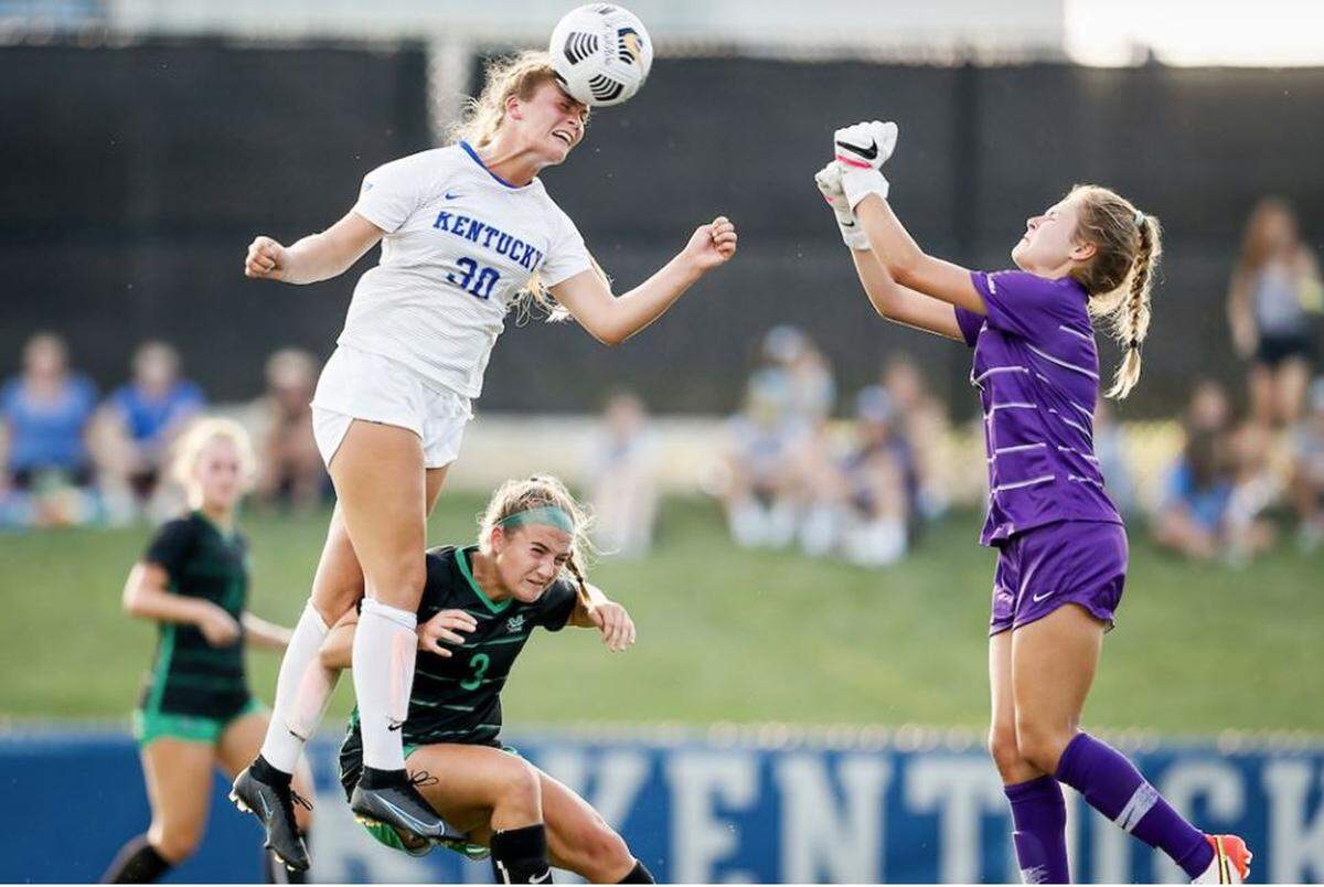 Kentucky’s Jordyn Rhodes soars for a header during the Wildcats’ 3-0 victory over Marshall in August. Rhodes scored a hat trick in the match, the second three-goal performance of her UK career.