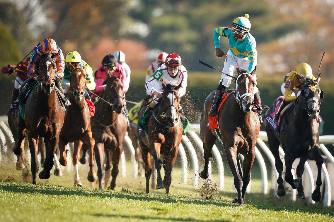 Ricardo Santana Jr., aboard Fire At Will, celebrated as he crossed the finish line first in the $1 million Breeders’ Cup Juvenile Turf at Keeneland on Friday. Fire At Will finished 3 lengths in front of Battleground. Outadore wound up third.