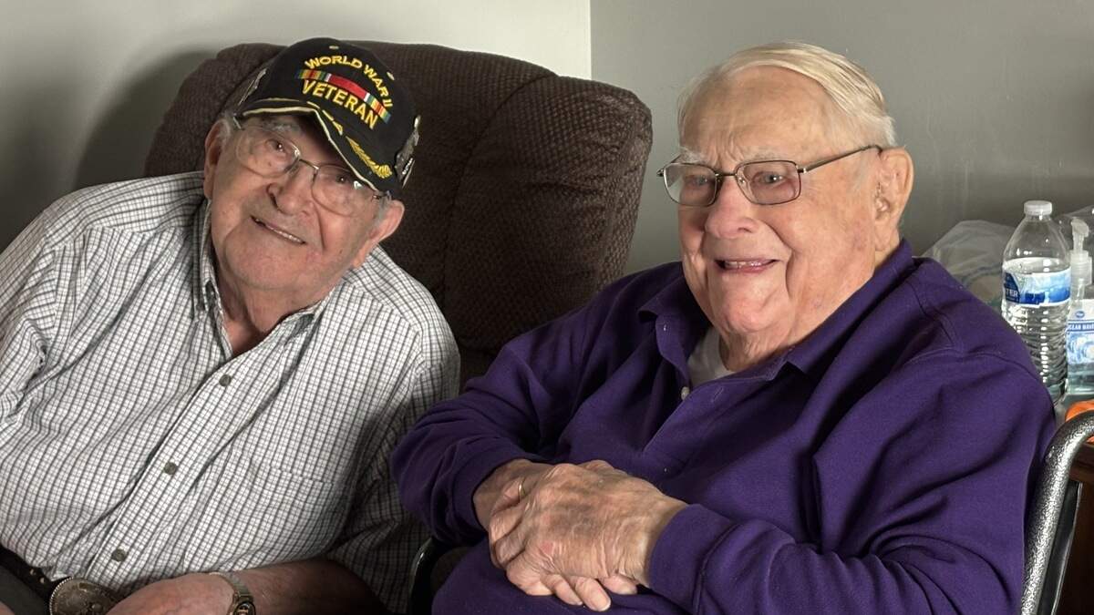 Ralph Denson (left) and Jim Hellard smile together at Hellard’s 100th birthday party on Sept. 17, 2025. Denson and Hellard fought alongside each other in World War II.