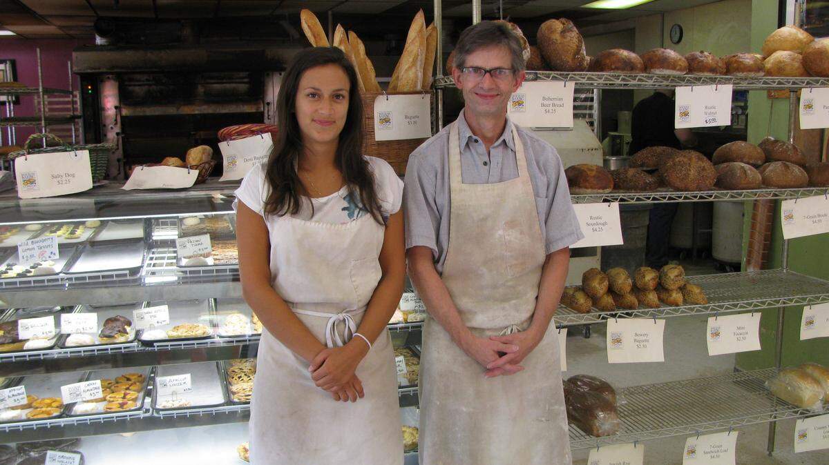 In this 2014 file photo, French intern Flora Vanneste stands with the bakery’s owner, Jim Betts, at the Bluegrass Baking Company on Clays Mill Road in  Lexington.