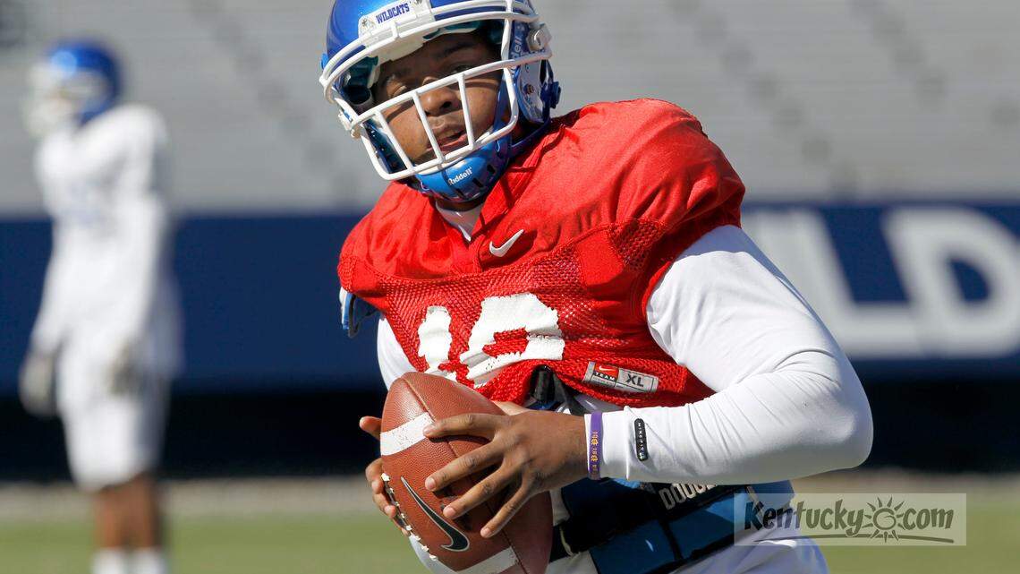 Quarterback Morgan Newton dropped back to pass in a practice before a morning UK football scrimmage at Commonwealth Stadium in Lexington, Ky., Saturday, April 07, 2012. Charles Bertram | Staff