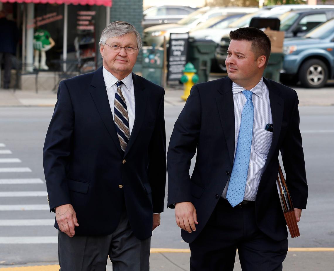 Dale Emmons, left, with attorney Brandon Marshall, right, walked Wednesday morning to the federal courthouse on Barr Street in Lexington for his first appearance on campaign finance charges.