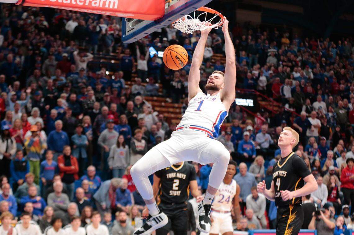 Michigan transfer Hunter Dickinson (1) had 21 points, eight rebounds and five assists in his Kansas regular-season debut, a 99-56 strafing of North Carolina Central.