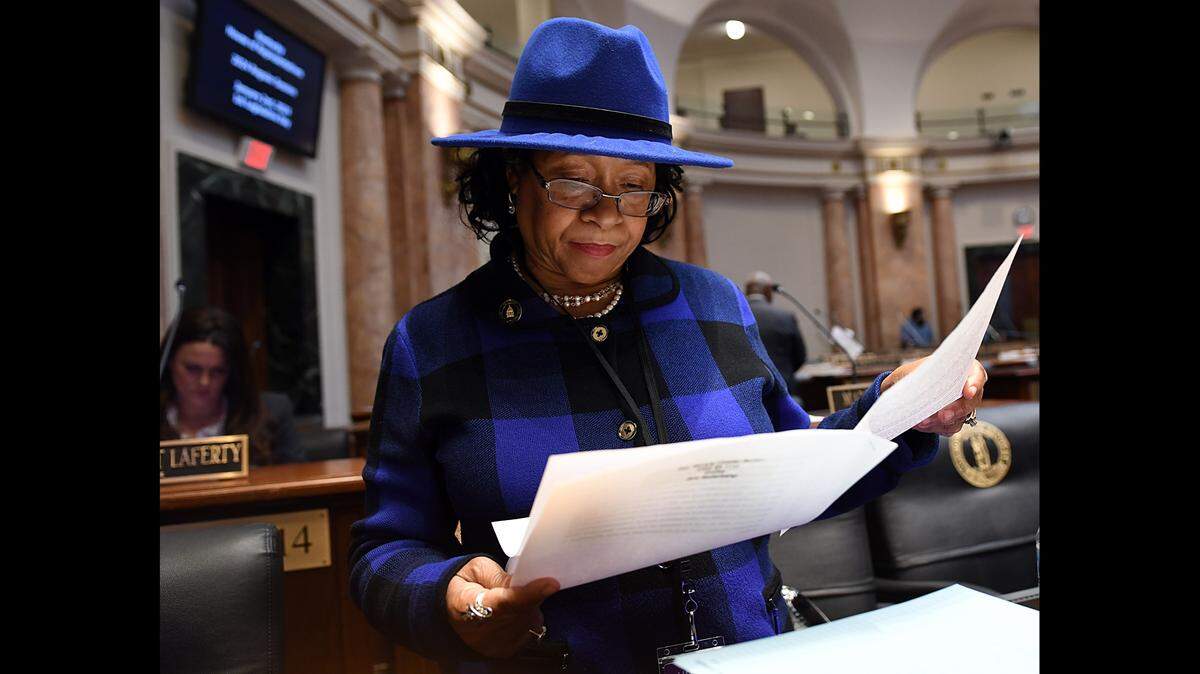 Rep. Beverly Chester-Burton, D-Shively, looks over her bills before filing them with the House clerk on the first day of the 2024 Kentucky General Assembly.