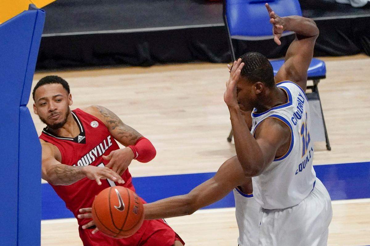 Louisville point guard Carlik Jones, left, has lived up to his billing as the top graduate transfer in men’s college basketball in 2020-21 after leaving Radford for U of L.