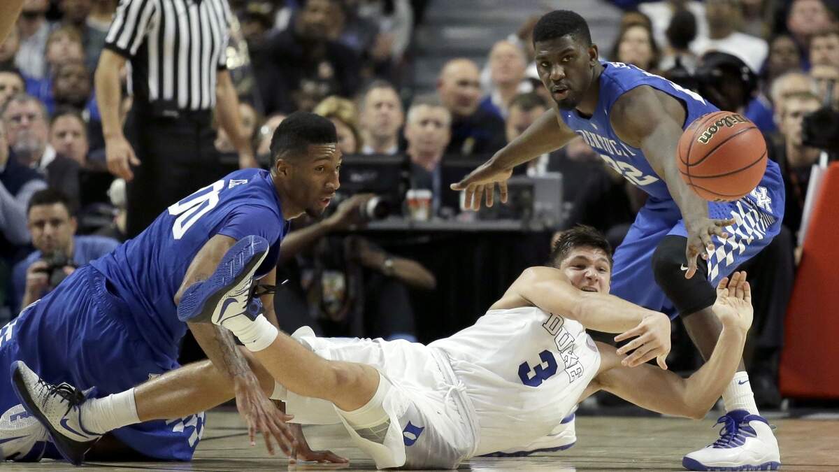 Duke guard Grayson Allen (3) passed under pressure from Kentucky forwards Marcus Lee (00) and Alex Poythress during their Champions Classic game in 2015. Those players are gone, but the rivalry will be renewed in Indianapolis on Nov. 6. Tickets go on sale via Ticketmaster.com on Oct. 8.