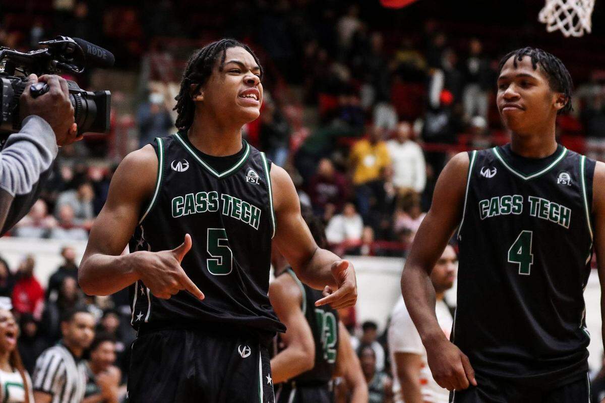 Detroit Cass Tech's Darius Acuff (5) celebrates a play against Birmingham Brother Rice  during the second half at Calihan Hall in Detroit on Friday, March 3, 2023.