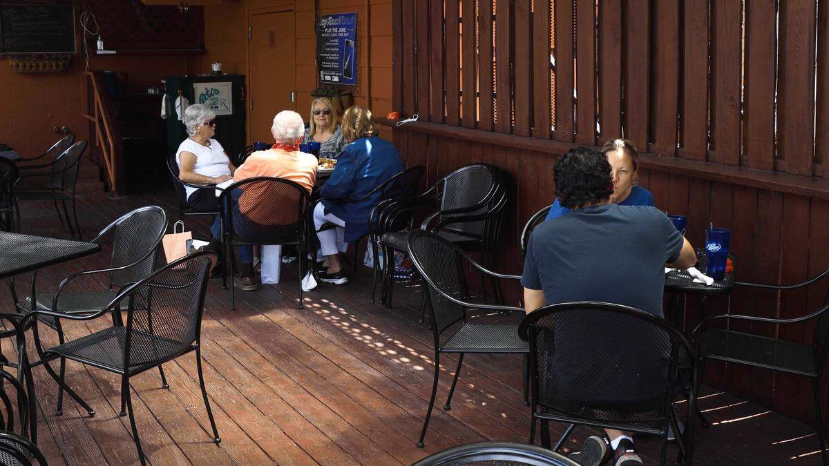 Charlie Brown’s restaurant on Euclid Avenue spaces patio tables 6 feet apart to maintain social distancing between customers, May 22, 2020, as Kentucky restaurants are allowed to reopen dining room spaces with limited capacity and social distancing rules.