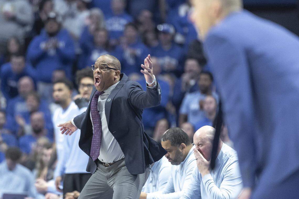North Carolina coach Hubert Davis (center) reacted during the Tar Heels’ 67-64 comeback victory over Kentucky and coach Mark Pope (foreground) in the ACC/SEC Challenge at Rupp Arena. Davis was fired as UNC head man Tuesday.