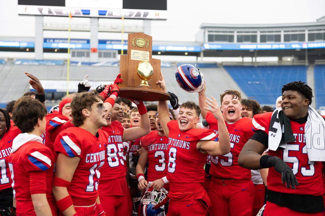 Christian Academy-Louisville celebrates with trophy after winning the Class 3A UK Healthcare Sports Medicine State Football Finals Saturday, December 6th, 2025 at Kroger Field in Lexington KY