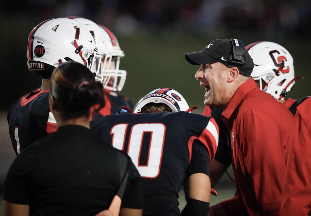 George Rogers Clark High School head coach Joe Chirico talks to his team during a time out in the first quarter of the West Jessamine at Paris KHSAA high school football game at Paris High School in Winchester, KY on Sept. 262025. Photo by Pablo Alcala