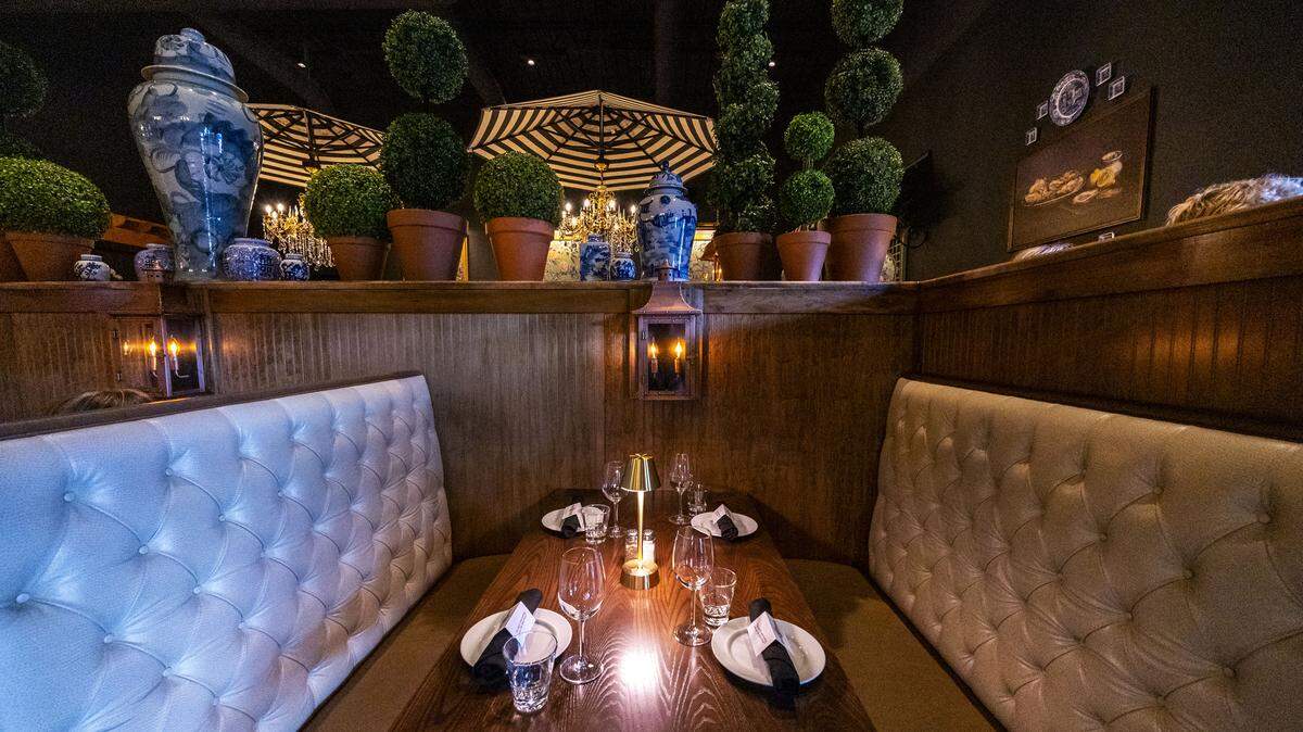 The decor at Carson’s Back Porch is “a Charleston porch brought indoors,” with exposed brick walls, the soft glow of chandeliers, flickering copper lanterns and plush tufted booths. The price point is slightly higher at the Back Porch than Carson’s two other locations, but the owners say they want people to “come as you are.”