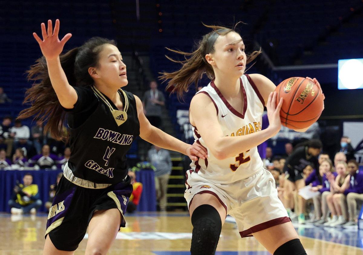 Cooper’s Liz Freihofer, right, is pressured by Bowling Green’s Emma Huskey (4) on Friday night. Freihofer led the Jaguars with 20 points.