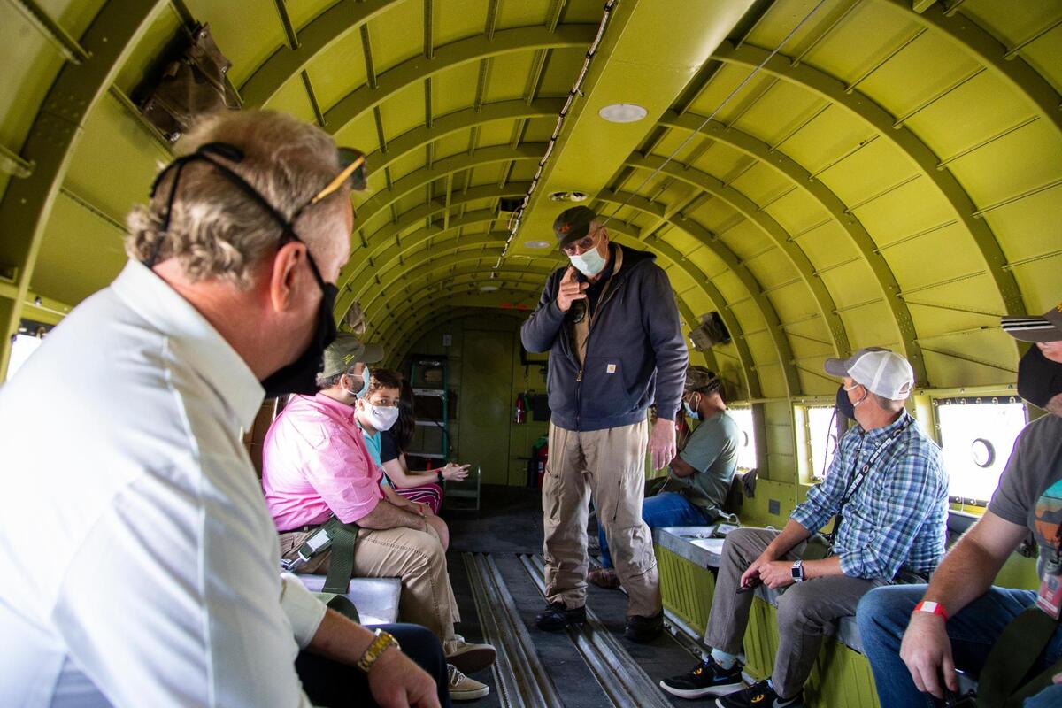 Tom Crawford gives information to passengers onboard “That’s All Brother” Friday.