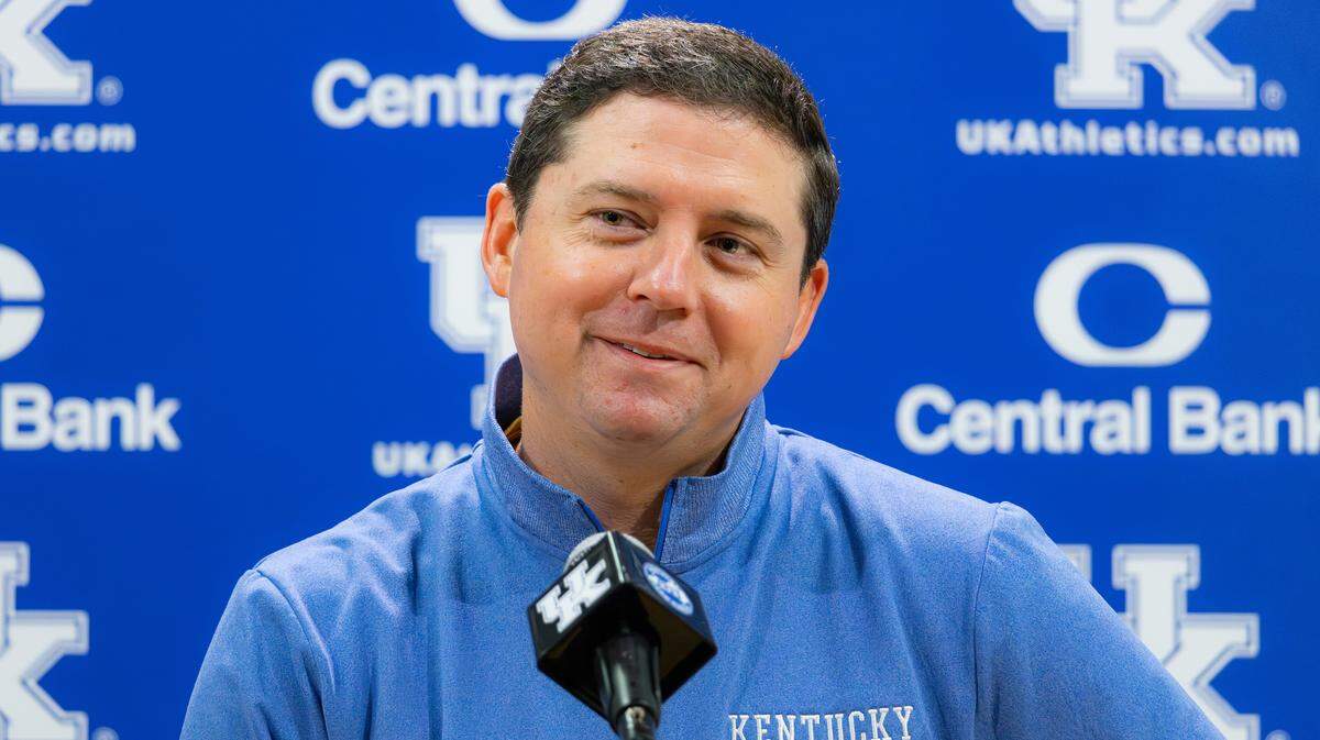 UK offensive coordinator Joe Sloan smiles during his introductory news conference in the media room at Kroger Field on Dec. 17, 2025, in Lexington, Ky.