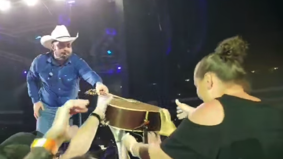 Thirty years after Jessica Cloukey got Garth Brooks’ guitar pick at a concert, she was gifted his guitar.
