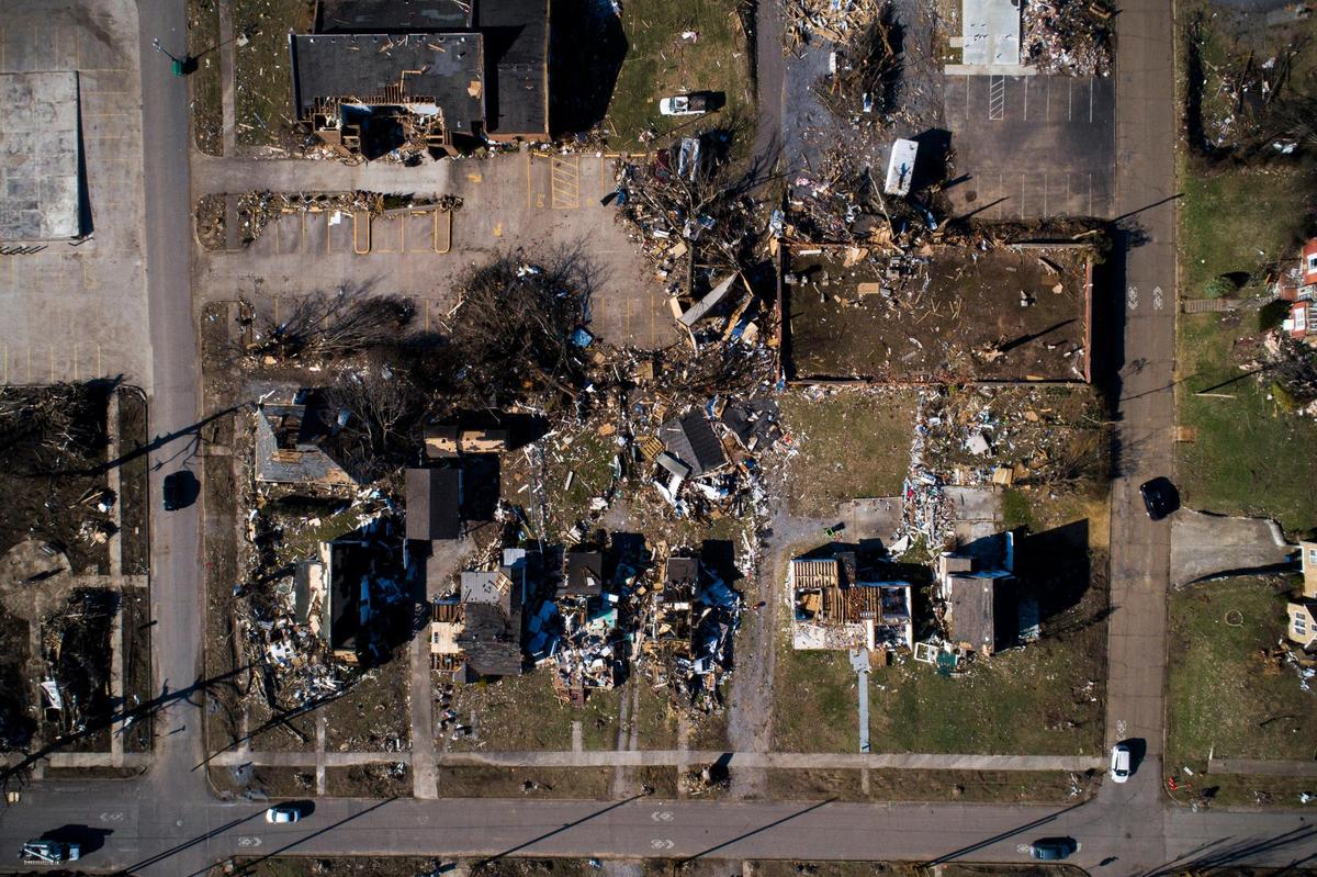 Destroyed homes and debris remain along North 6th Street in Mayfield, Ky., Wednesday, Jan. 5, 2022.