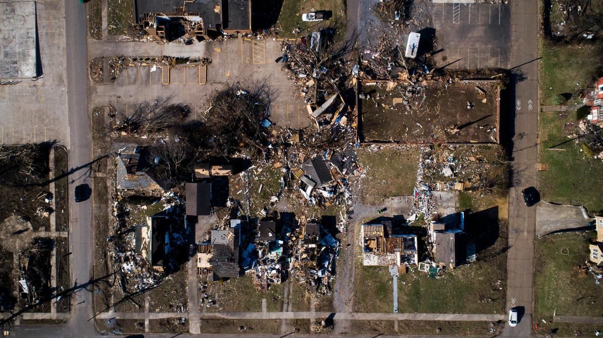 Destroyed homes and debris remain along North 6th Street in Mayfield, Ky., Wednesday, Jan. 5, 2022.