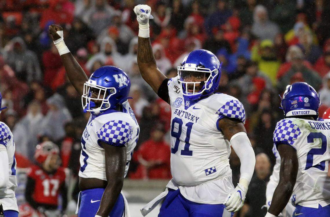 Kentucky’s Calvin Taylor, right, is second in the SEC in 2019 with eight quarterback sacks.