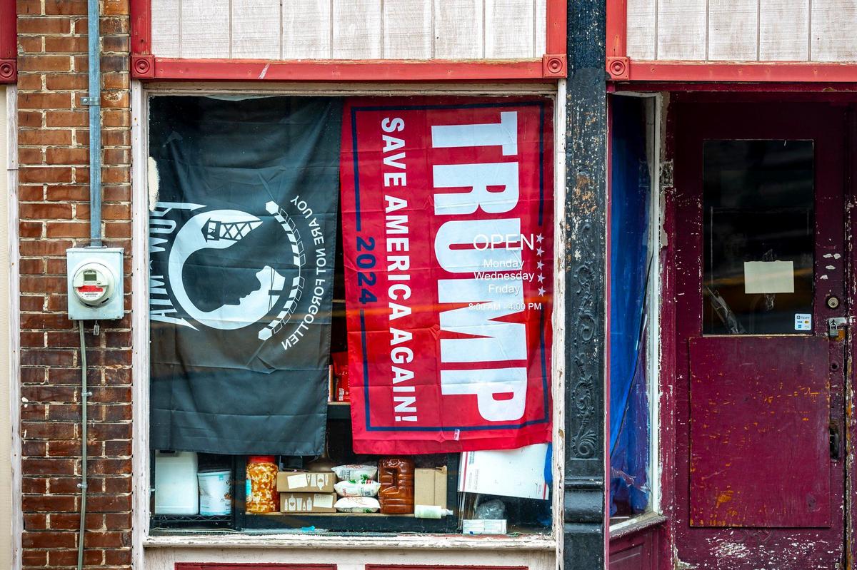 A Trump flag hangs inside a business in downtown Jackson, Ky., in Breathitt County, Wednesday, July 17, 2024.