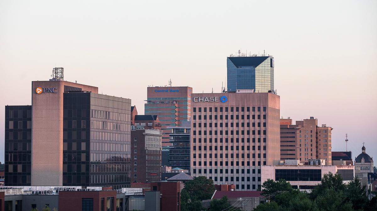 The rising sun shines on the downtown Lexington, Ky., skyline Friday, July 24, 2020.