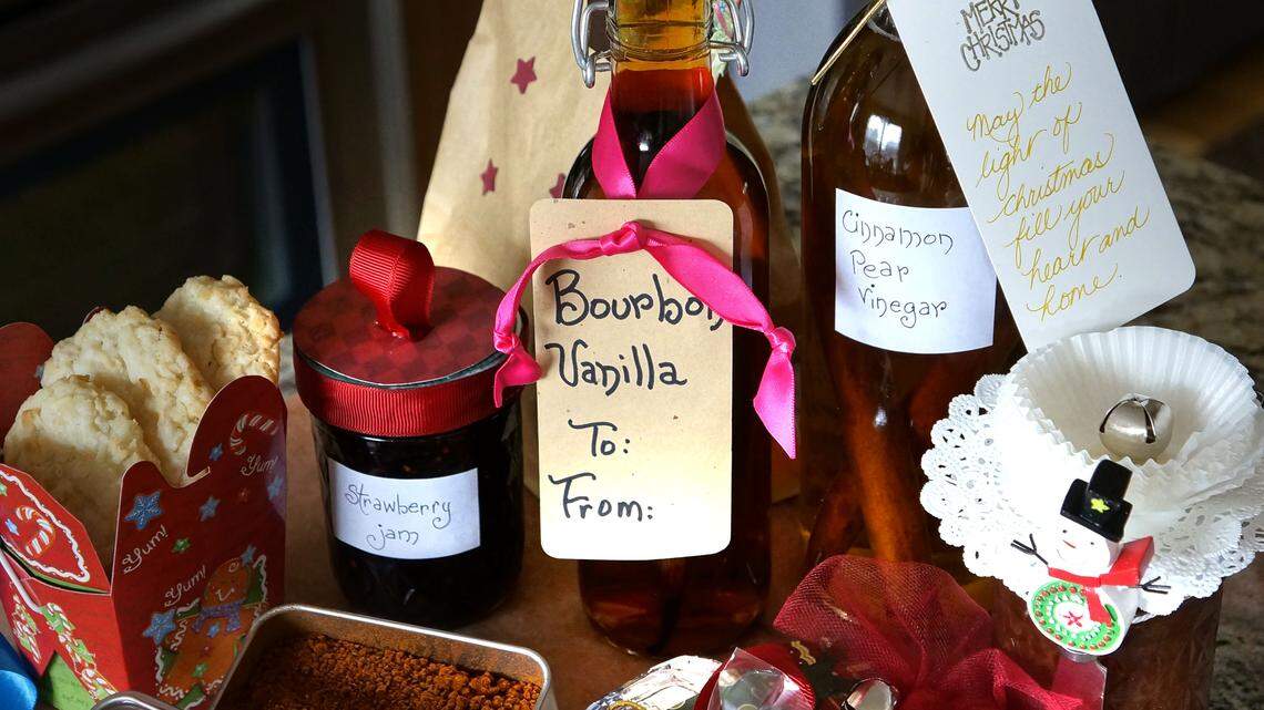 Homemade holiday gifts can include — but certainly are not limited to — clockwise from back left, cookies, jam, bourbon vanilla, vinegar, more jam, foil-wrapped candy bark, chocolate-dipped peppermint sticks and barbecue rub. Look around the house for creative ways to package the goodies.    
