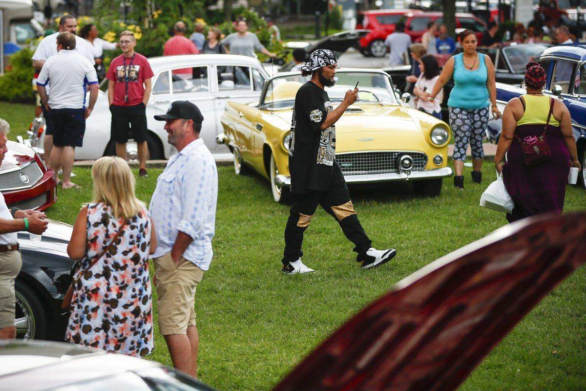 Hundreds of people gather in downtown Lexington, Ky., Friday, June 21, 2019, for the Maserati Mingle.