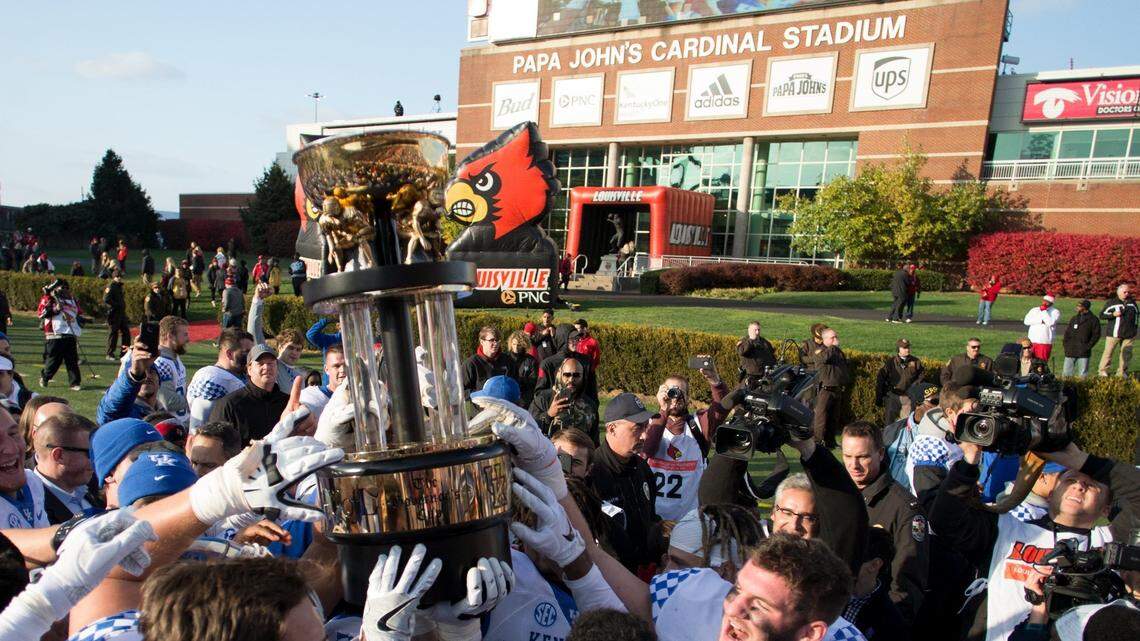Kentucky players hoisted the Governor’s Cup after they defeated Louisville in 2016 at Papa John’s Cardinal Stadium. The stadium’s name came under scrutiny from some Louisville players following the admission of a racist comment by the company’s founder, John Schnatter.
