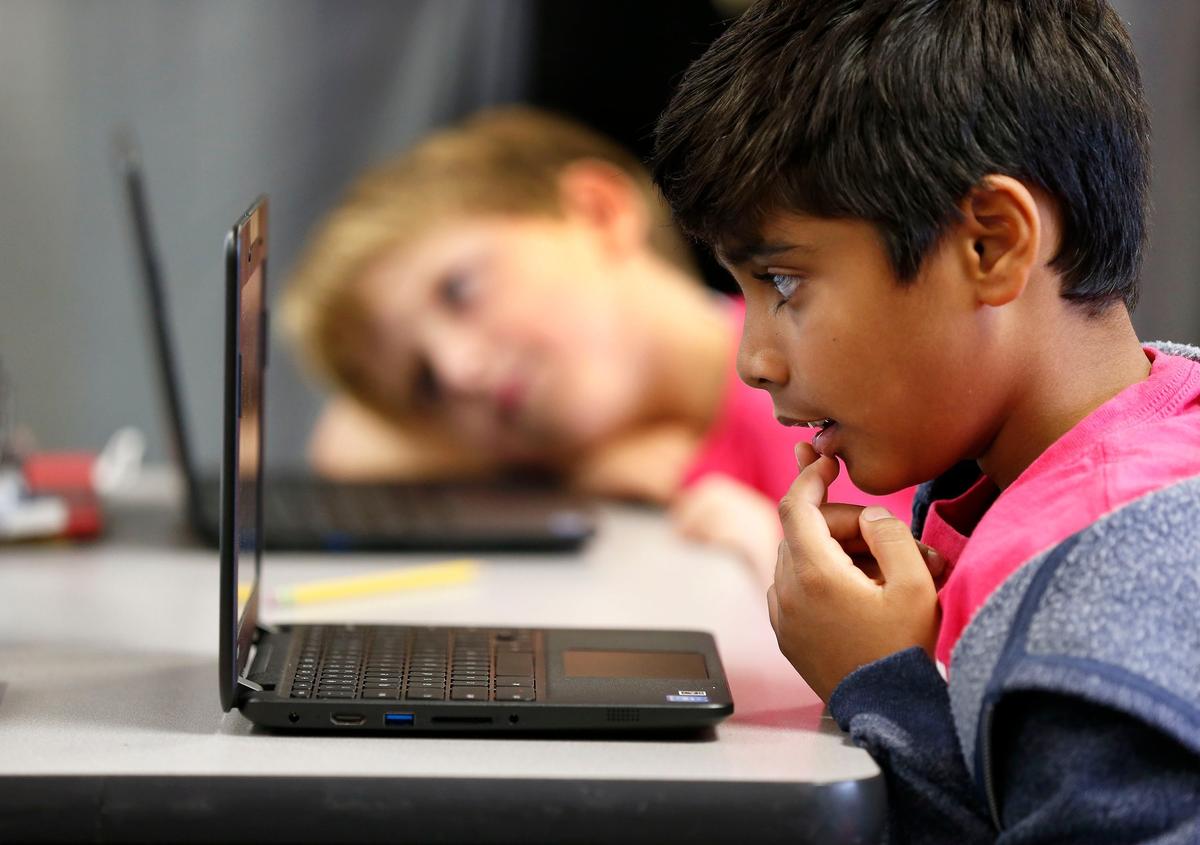 Adwik Gunjan, front, and Lee Chappell, back, worked in teacher Tara Vincent’s third grade class Tuesday afternoon at Rosa Parks Elementary School, 1251 Beaumont Centre Lane. The school is one of the top 10 elementary schools in the state in student performance in reading and math.